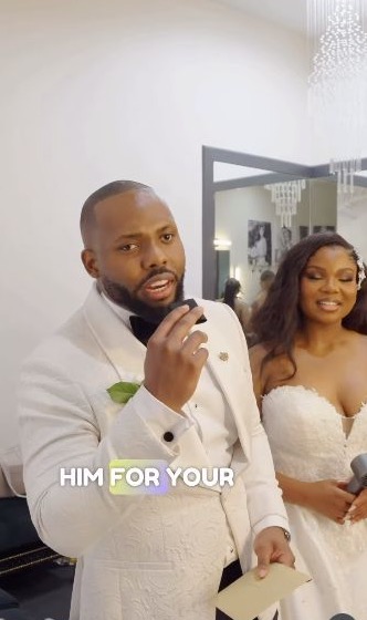 A groom speaking about his event experience, with the bride beside him